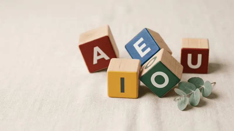 Colourful wooden alphabet blocks spelling AEIOU scattered on linen, representing the collapse of AEIOU Foundation