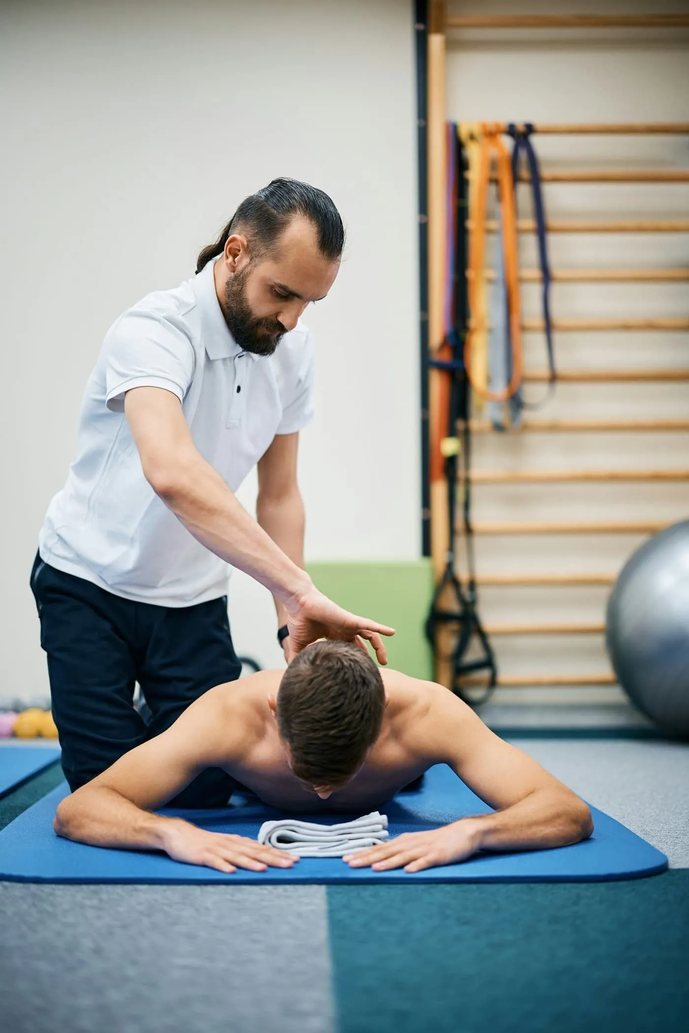 Physiotherapist consulting with patient in modern clinic setting