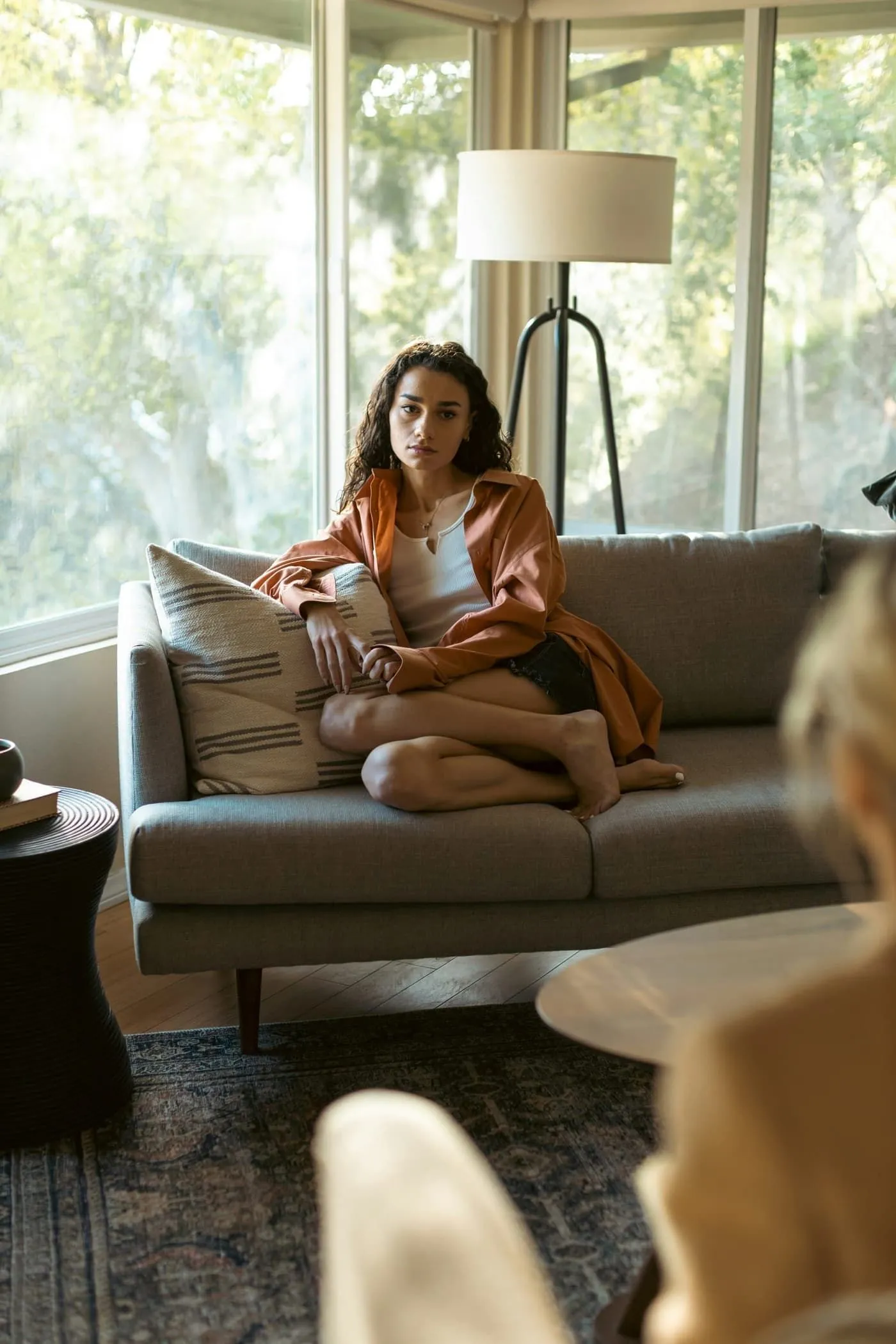 Occupational therapist working with a child using sensory equipment in a bright therapy room
